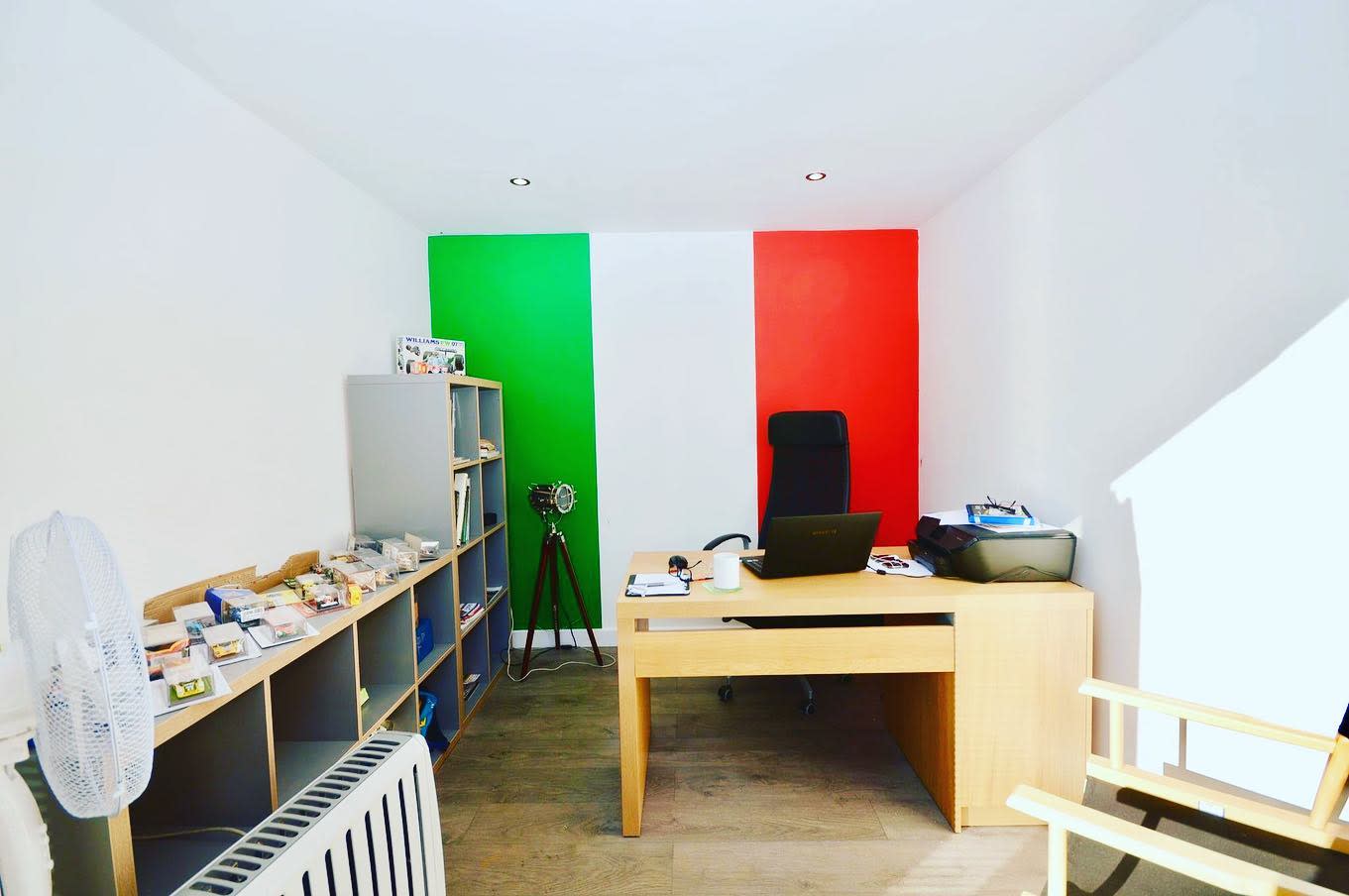 garage office wood desk italian flag feature wall